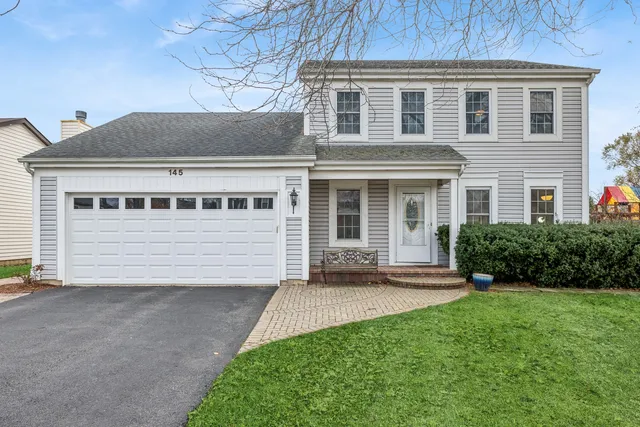 a house view with a garden space