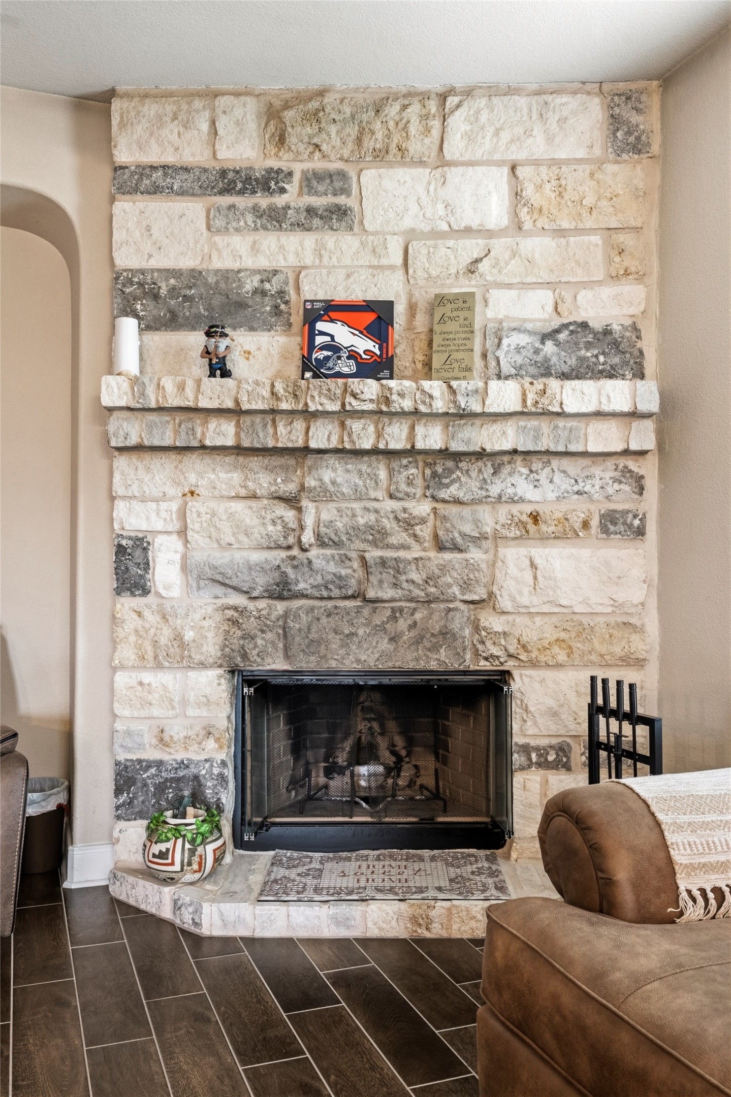 105 West Point Way Elgin, TX 78621 - Photo 20 of 27 Stone-clad fireplace featuring a raised hearth and mantel