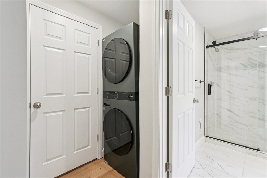 49 Jamaica Street, Unit 2 Boston, MA 02130 - Photo 13 of 19 a close view of a bathroom with a washer and dryer