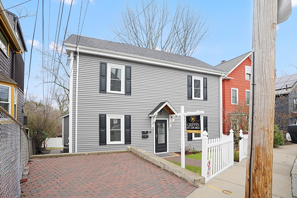 49 Jamaica Street, Unit 2 Boston, MA 02130 - Photo 2 of 19 a front view of a house with an outdoor space