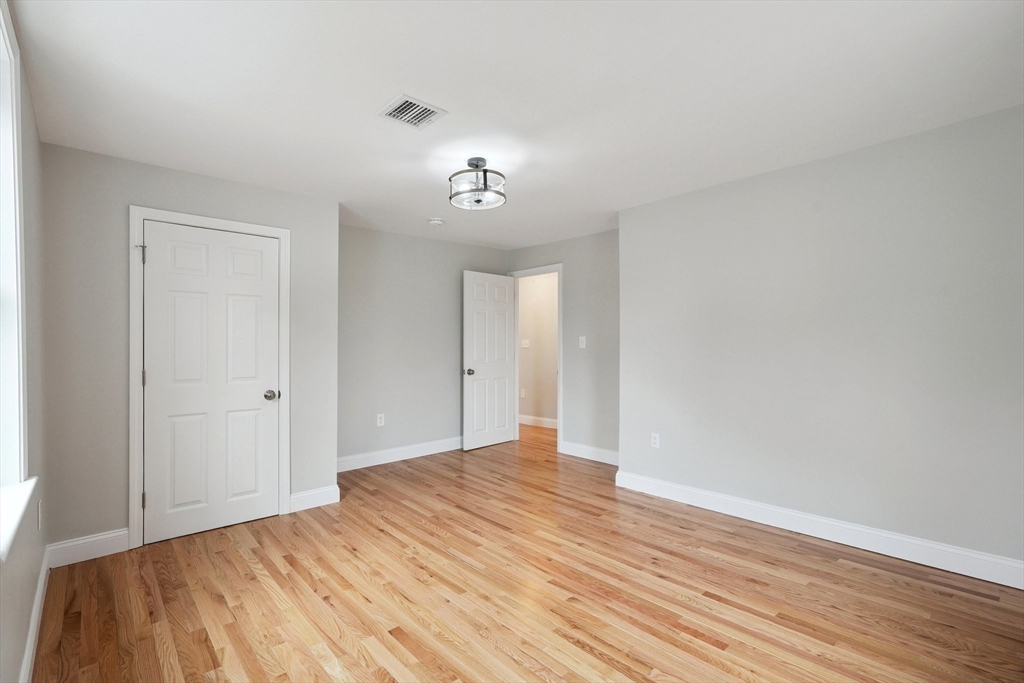 49 Jamaica Street, Unit 2 Boston, MA 02130 - Photo 8 of 19 a view of empty room with wooden floor