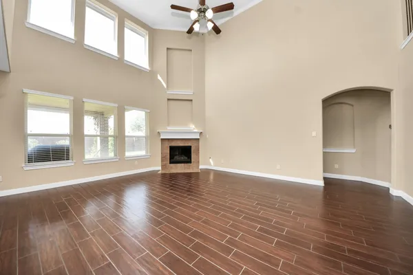 a large kitchen with stainless steel appliances granite countertop a large counter top a stove a sink and a refrigerator