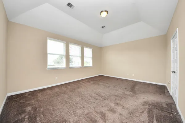 an empty room with windows