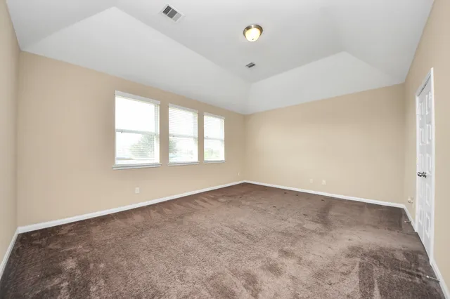 an empty room with windows