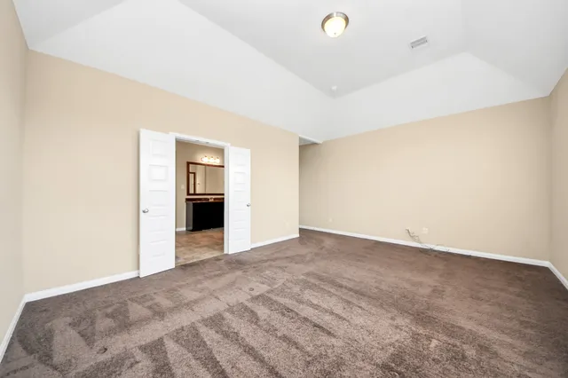 a view of an empty room with a fireplace