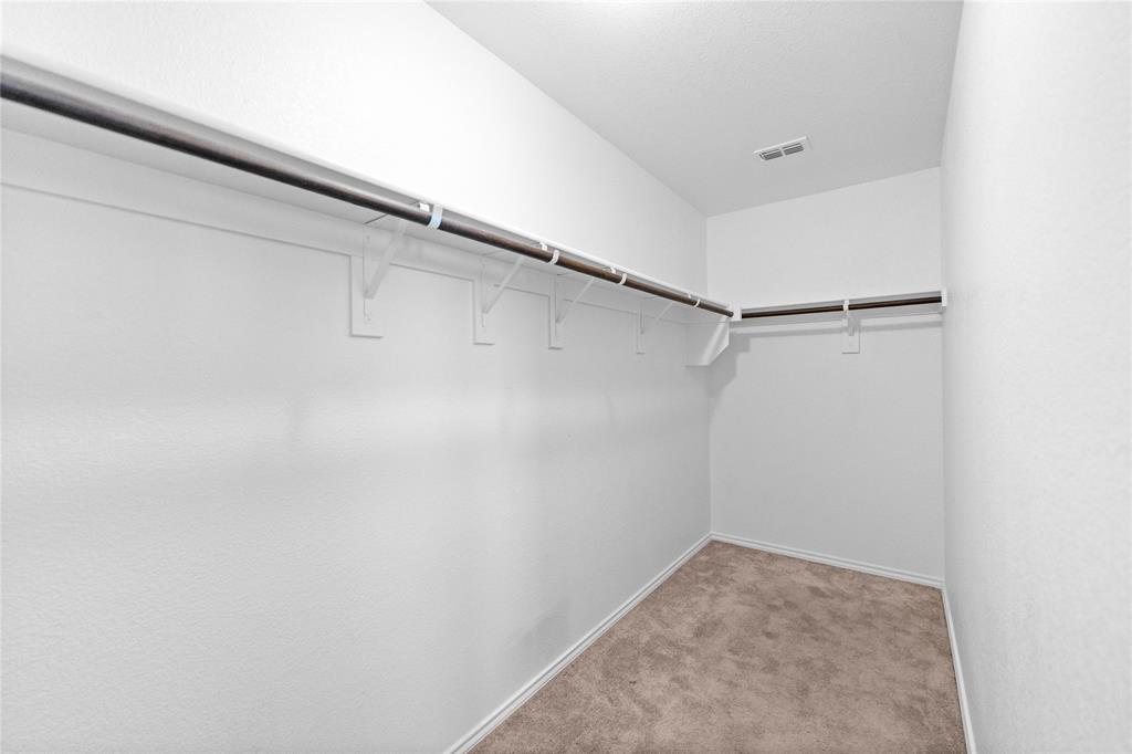 4432 Sagecroft Road Fort Worth, TX 76036 - Photo 13 of 16 Walk in closet with light colored carpet
