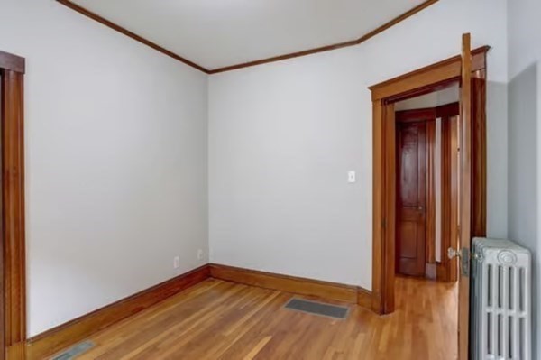 42 Lagrange Street, Unit 1 Boston, MA 02132 - Photo 20 of 29 a view of a hallway with wooden floor
