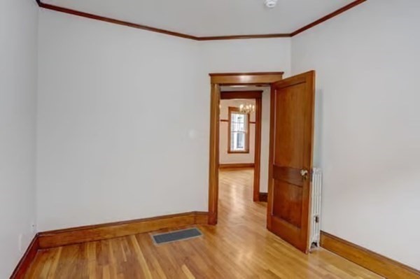 42 Lagrange Street, Unit 1 Boston, MA 02132 - Photo 21 of 29 a view of empty room with wooden floor