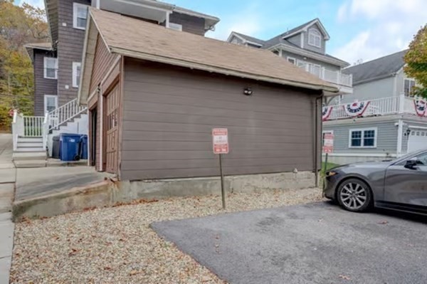 42 Lagrange Street, Unit 1 Boston, MA 02132 - Photo 25 of 29 a front view of a house with parking area