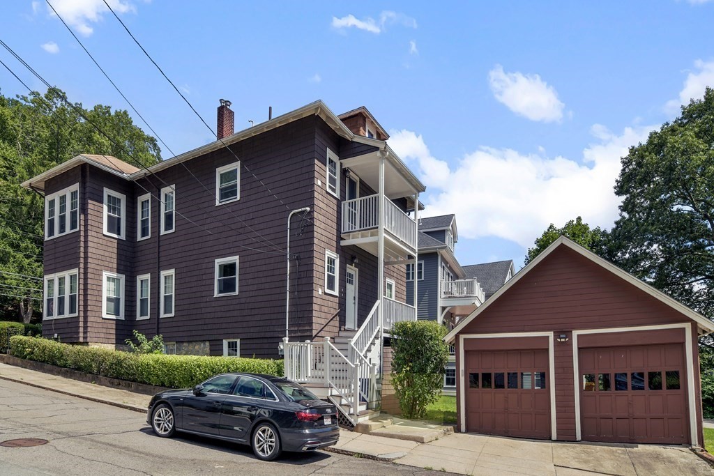 42 Lagrange Street, Unit 1 Boston, MA 02132 - Photo 26 of 29 a car parked in front of a house