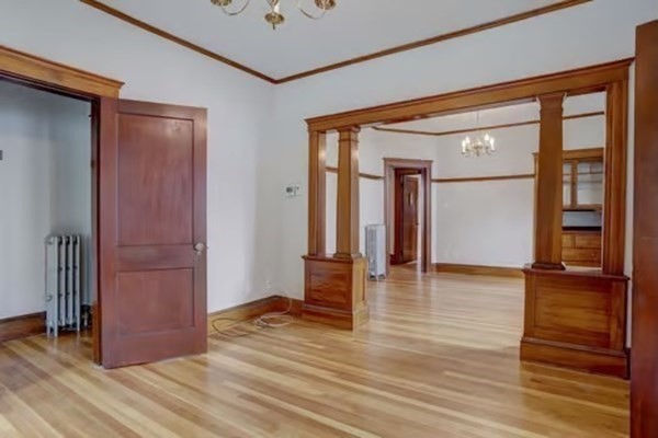 42 Lagrange Street, Unit 1 Boston, MA 02132 - Photo 3 of 29 a view of empty room with wooden floor and fan