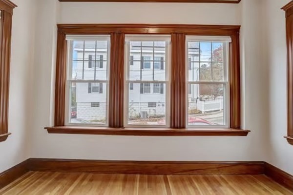 42 Lagrange Street, Unit 1 Boston, MA 02132 - Photo 5 of 29 a view of a room that has a bed and a window