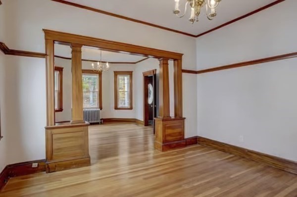 42 Lagrange Street, Unit 1 Boston, MA 02132 - Photo 6 of 29 wooden floor in an empty room with a window