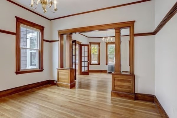 42 Lagrange Street, Unit 1 Boston, MA 02132 - Photo 7 of 29 a view of empty room with wooden floor and fan