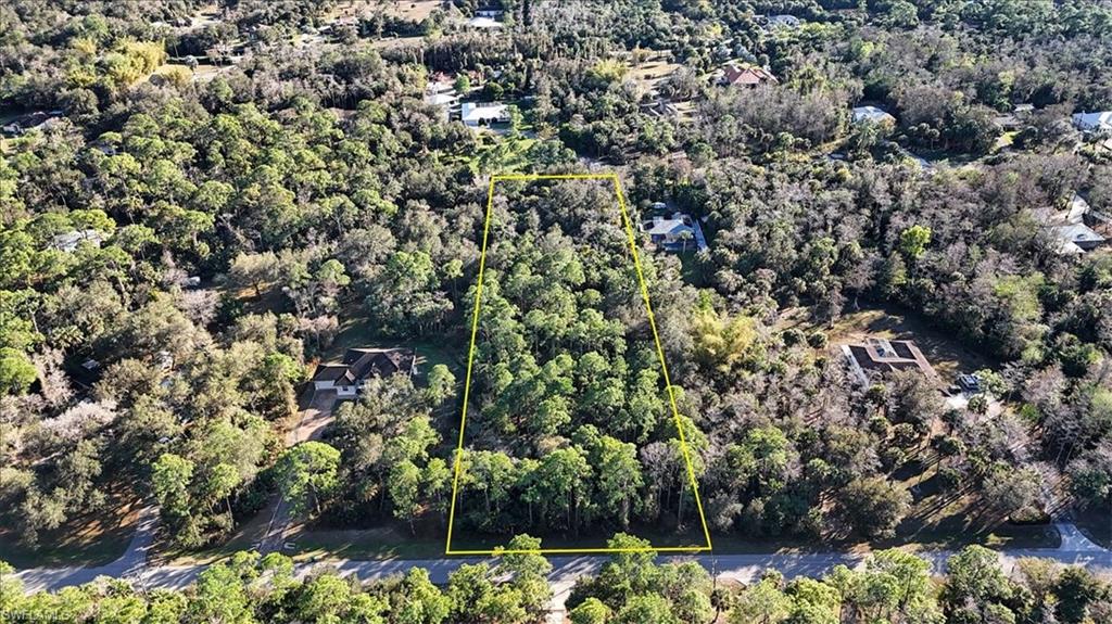 4-xx 18th Avenue Northwest Naples, FL 34102 - Photo 2 of 6 a view of a tree with a tree