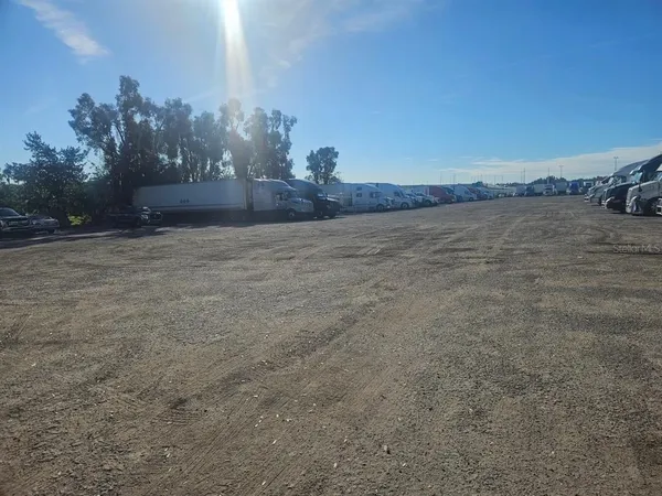a view of a field with an ocean