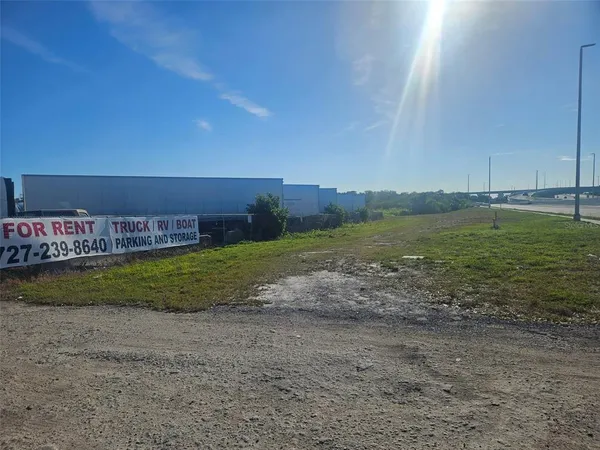 a view of a building with a big yard
