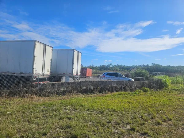 a view of a swimming pool with a yard