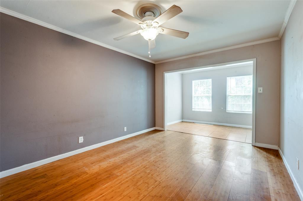 412 Hollyhill Lane Denton, TX 76205 - Photo 11 of 15 wooden floor in an empty room with a window