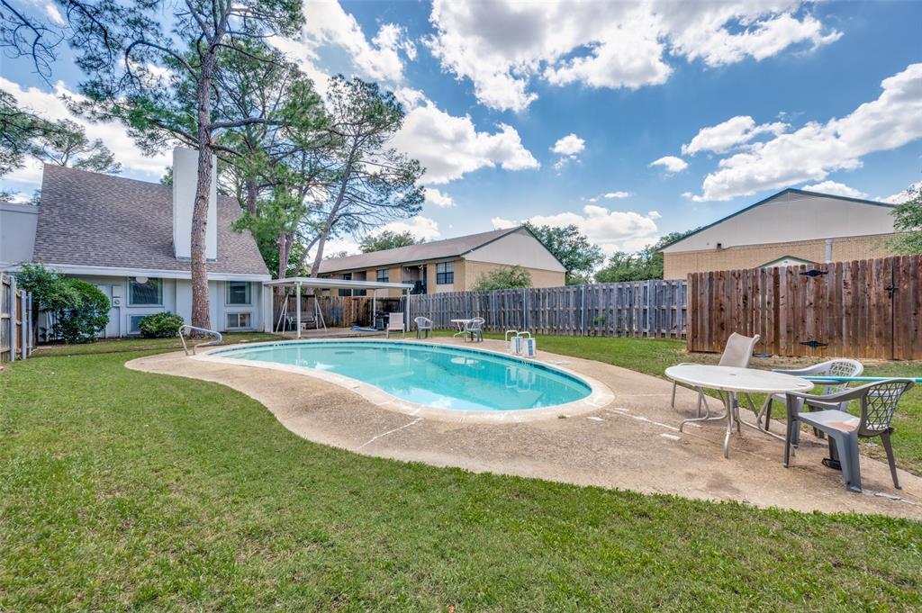 412 Hollyhill Lane Denton, TX 76205 - Photo 14 of 15 a view of backyard with swimming pool and outdoor seating