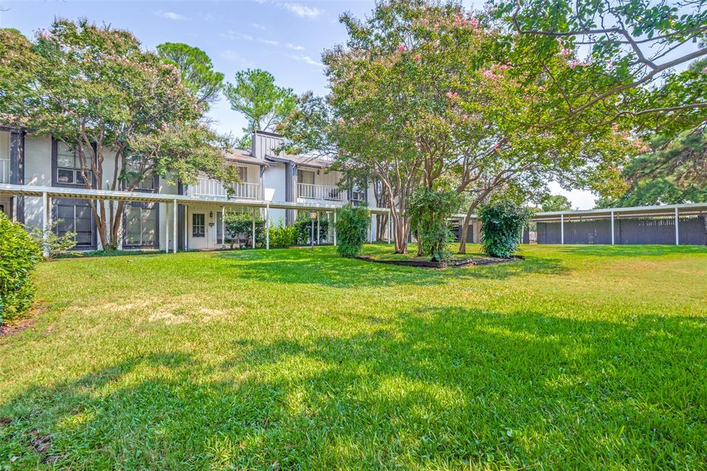 412 Hollyhill Lane Denton, TX 76205 - Photo 2 of 15 a view of a house with a big yard and large trees