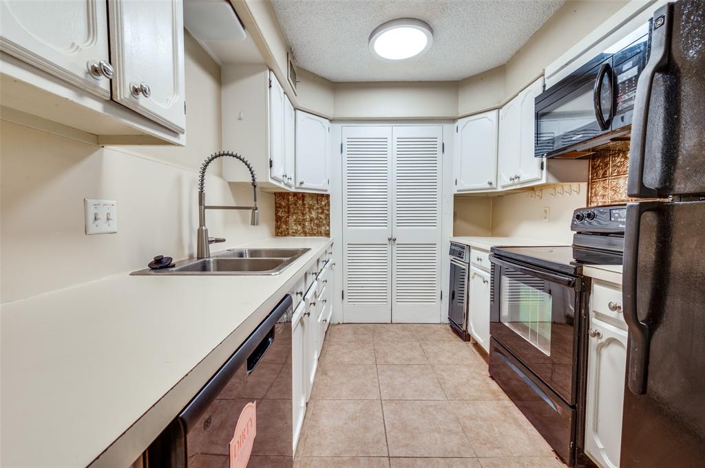 412 Hollyhill Lane Denton, TX 76205 - Photo 8 of 15 a kitchen with a sink appliances and cabinets