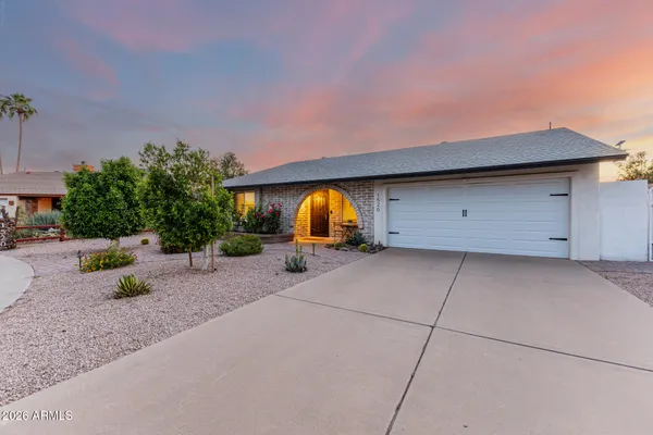 a view of garage and yard