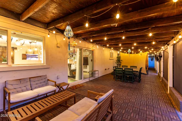 a outdoor space with lots of furniture and a rug