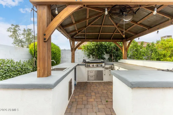 a house view with a sink and yard in the back