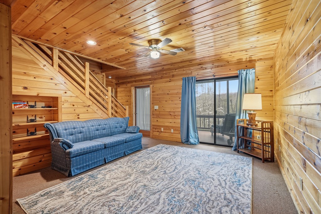 238 Cedar Ridge Road Cherry Log, GA 30522 - Photo 17 of 22 a living room with furniture and a flat screen tv