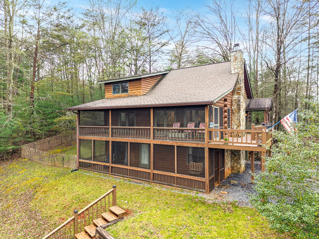 238 Cedar Ridge Road Cherry Log, GA 30522 - Photo 3 of 22 a view of a house with pool and garden