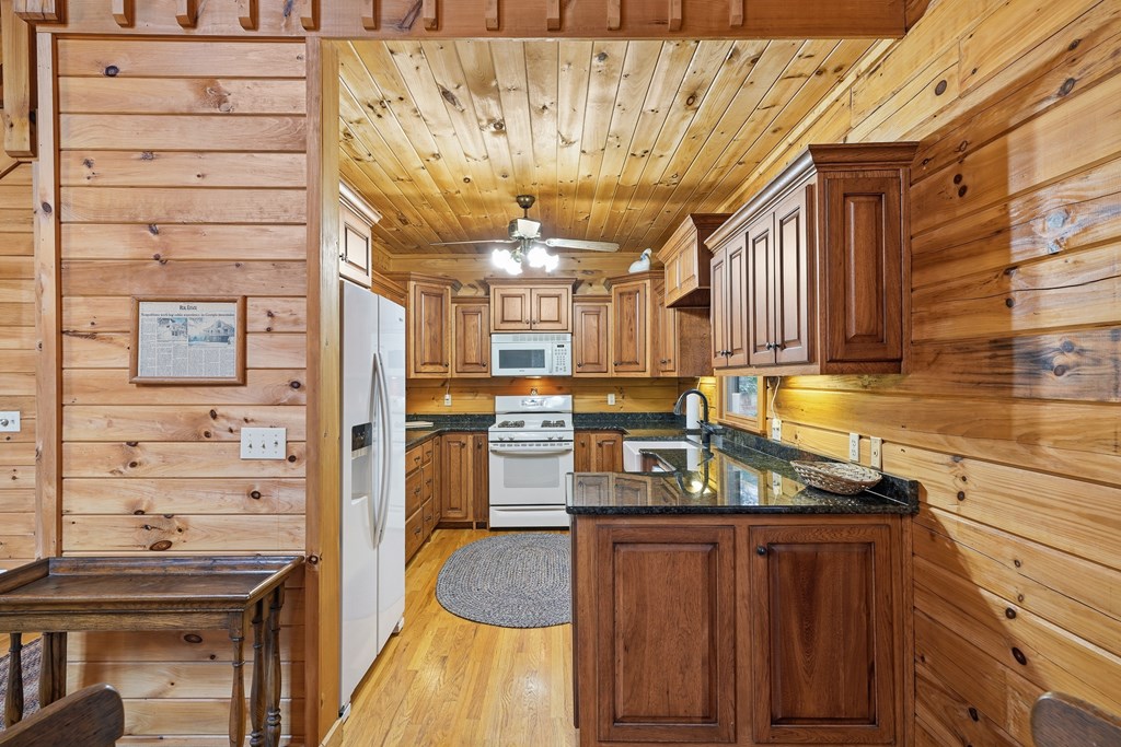 238 Cedar Ridge Road Cherry Log, GA 30522 - Photo 8 of 22 a kitchen with granite countertop a sink and cabinets