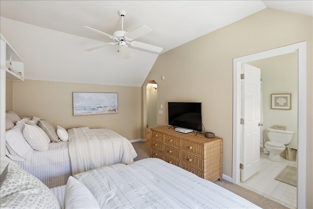 100 Mid-Iron Way, Unit 7027 Mashpee, MA 02649 - Photo 20 of 38 a bedroom with a bed and a flat screen tv