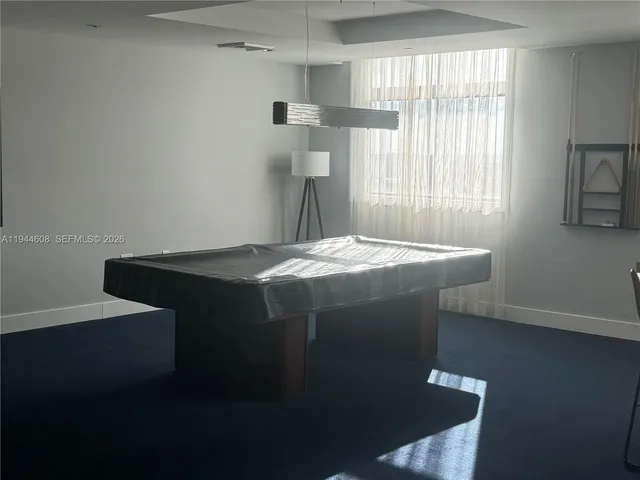 a room with a bed and a window