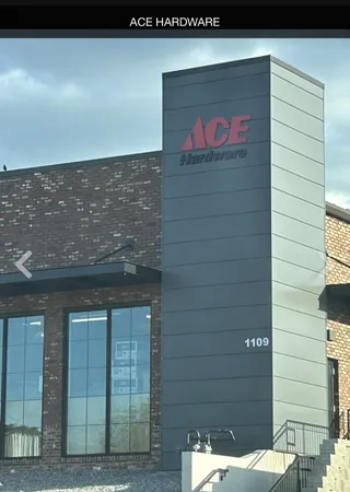 a view of outdoor space with signage and flags