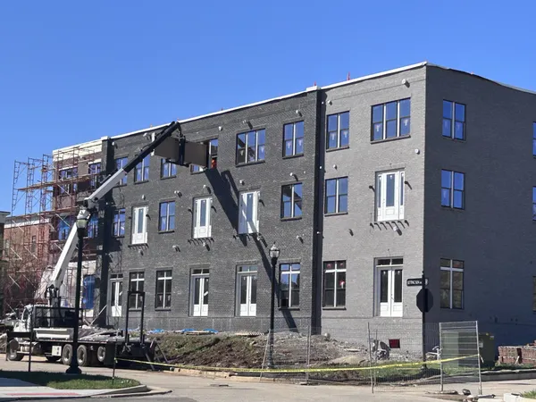 a front view of a building with street view