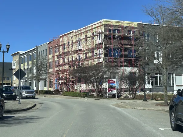 a view of a building and a street