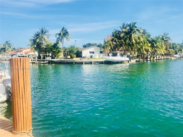 an ocean view with residential houses with outdoor space
