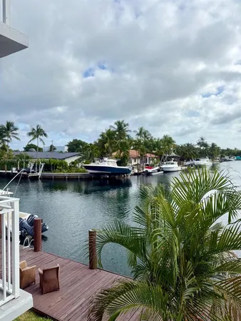 a view of a lake with houses in the back