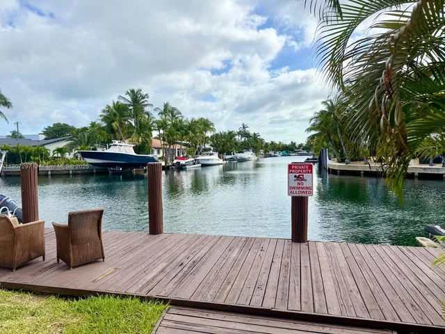 a wooden bench sitting next to a lake
