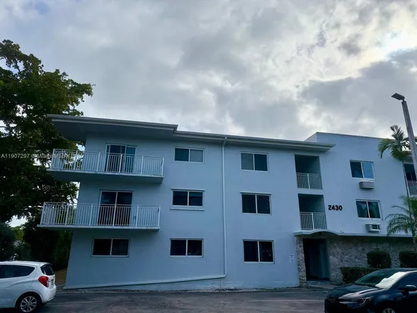 a front view of residential houses with outdoor space