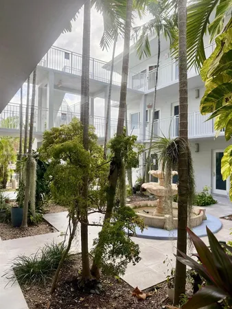 a view of potted plants in front of building