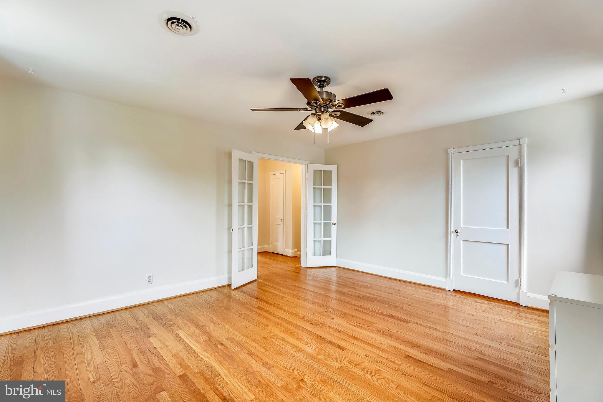 57 Murdock Road Baltimore, MD 21212 - Photo 17 of 44 Master bedroom with ceiling fan and walk-in closet