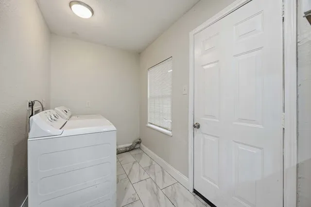 a utility room with a washer and dryer