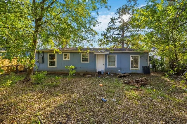 a house view with a backyard space