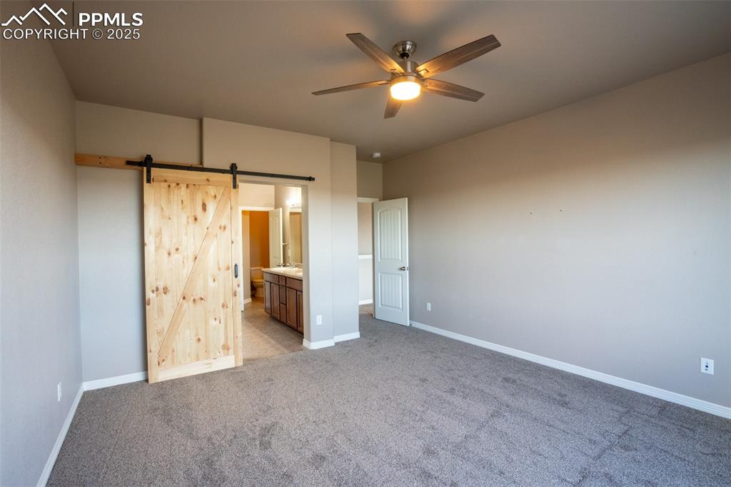 1985 Reed Grass Way Colorado Springs, CO 80915 - Photo 11 of 37 a view of an empty room with a bathroom