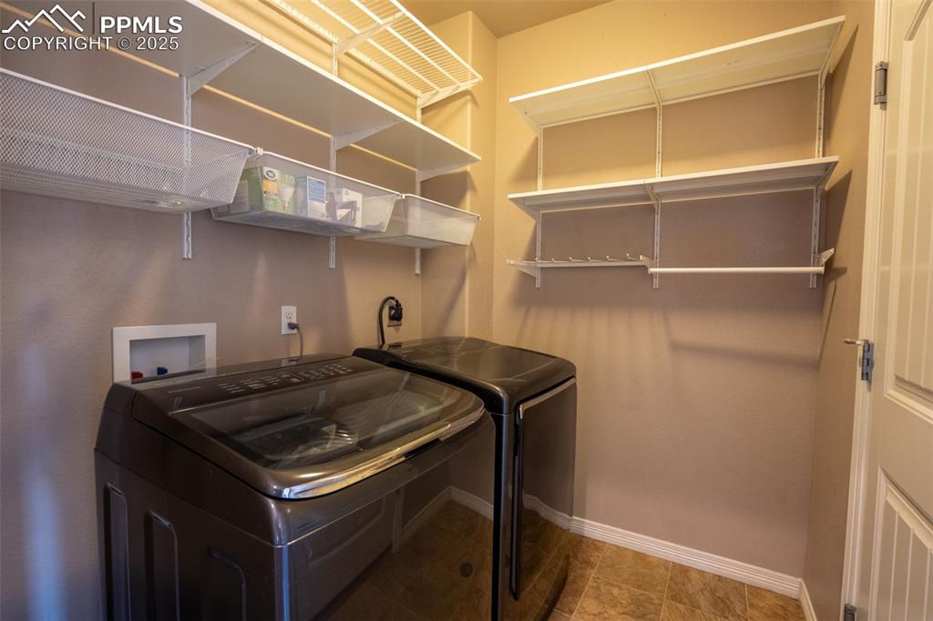 1985 Reed Grass Way Colorado Springs, CO 80915 - Photo 18 of 37 a utility room with dryer and washer