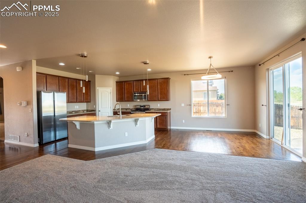 1985 Reed Grass Way Colorado Springs, CO 80915 - Photo 9 of 37 a view of kitchen with refrigerator stove window and cabinets