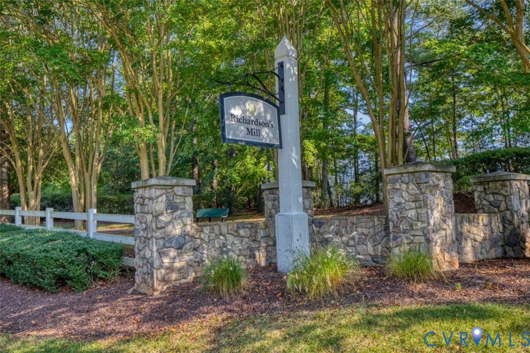 9960 Mill Pond Road Toano, VA 23168 - Photo 40 of 42 Stone entry columns and retaining wall with a whit