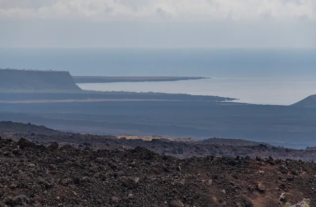a view of ocean and mountains